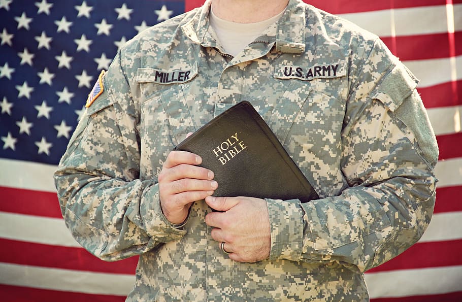 Military chaplain holding a bible