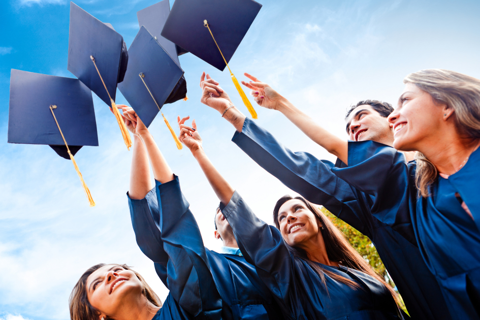 graduates throwing caps