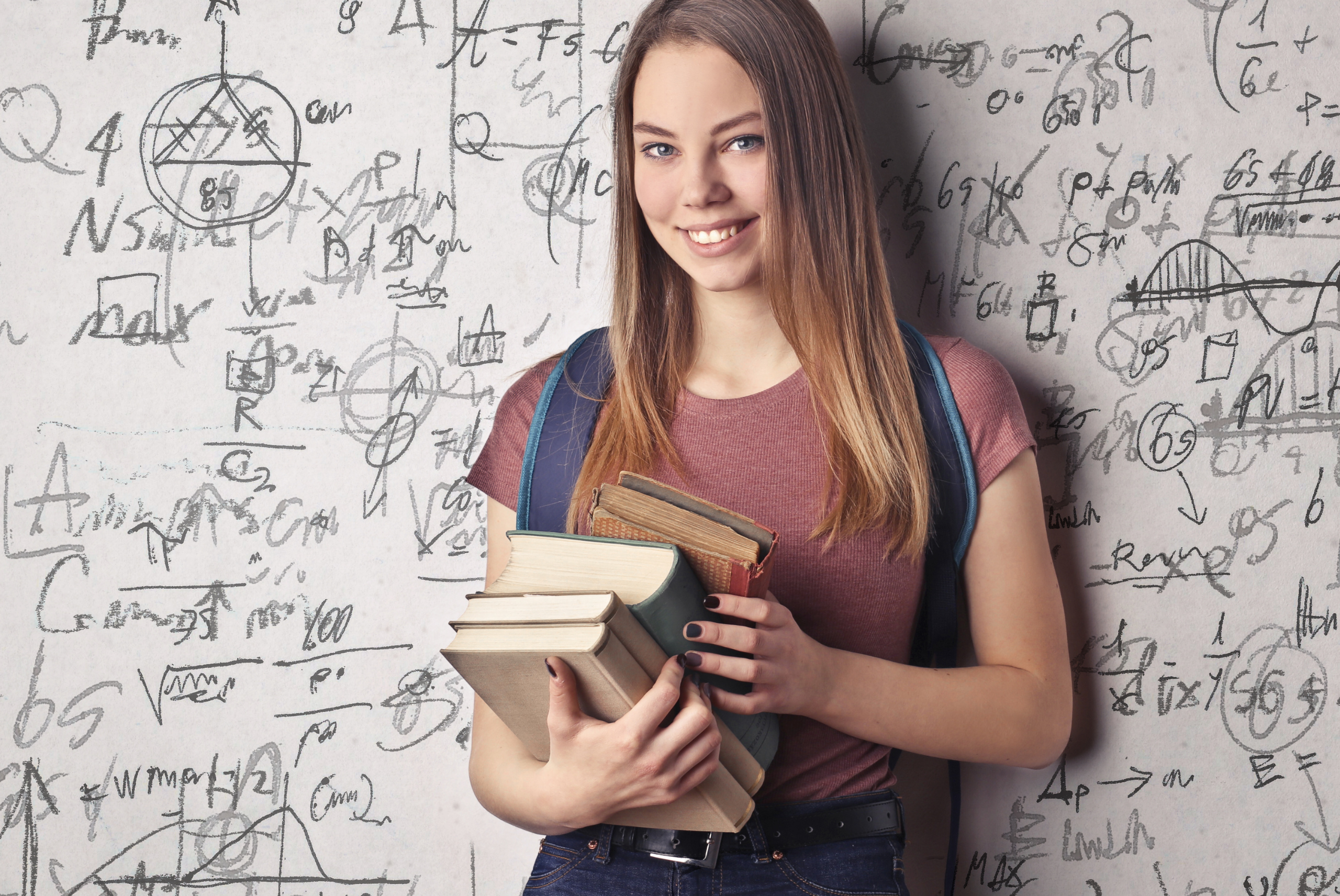 Female college student holding books