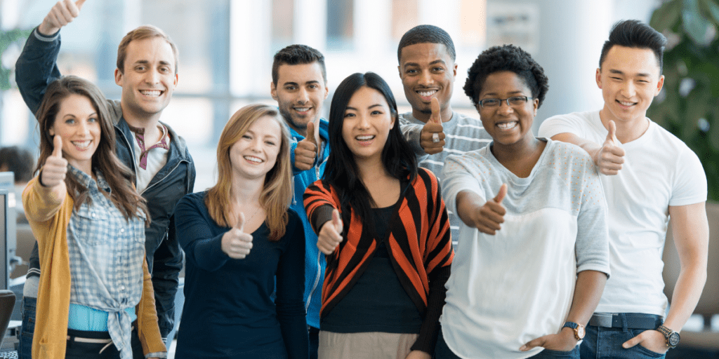 group of young adults giving "thumbs up"